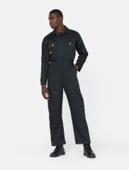 Model is shown wearing the dickies redhawk boiler suit in black. Model is also wearing work boots. 