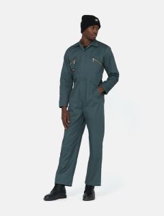 Dickies boilersuit in lincoln green demonstrated on model. Model is also wearing a black dickies beanie and work boots.